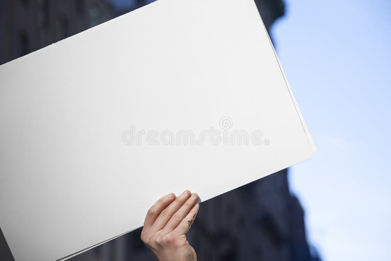 Blank White Protest Sign Hand with Urban Background
