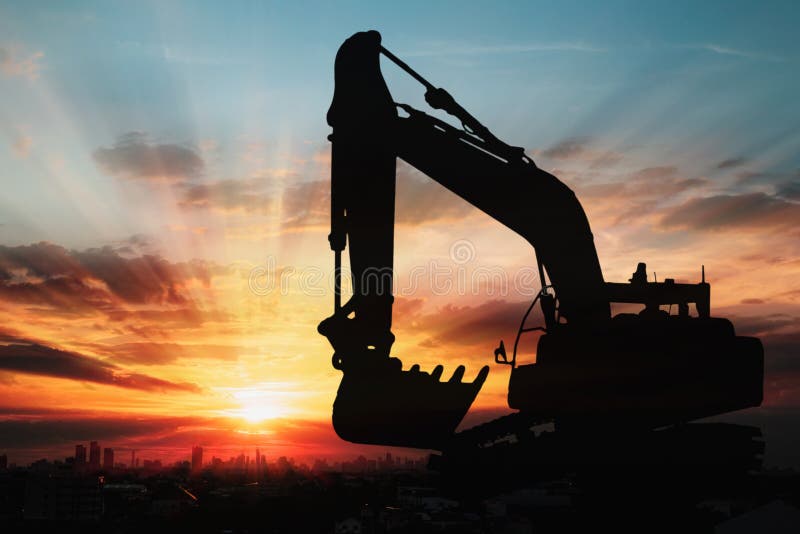 Image silhouette  of excavator loader  with sunset on last light  background