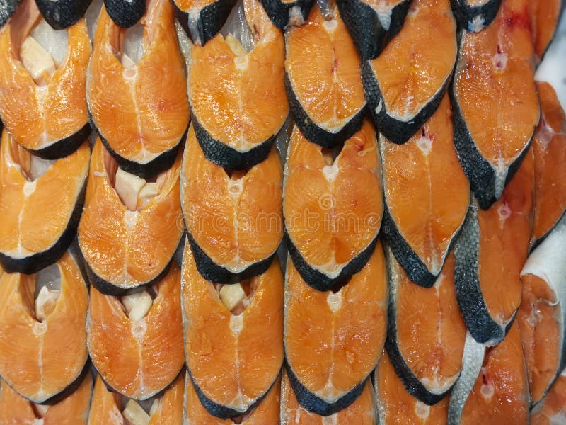 Sliced or Cut Ready Fresh Salmon Fish Meat for Sale. Stock Photo