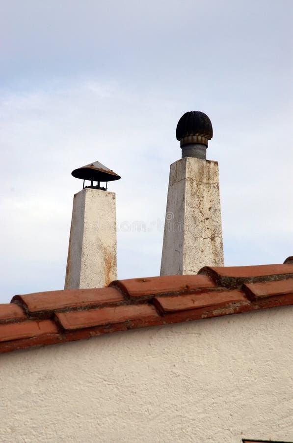 Smoke Extraction Chimneys Located on Top of the Roof Stock Photo