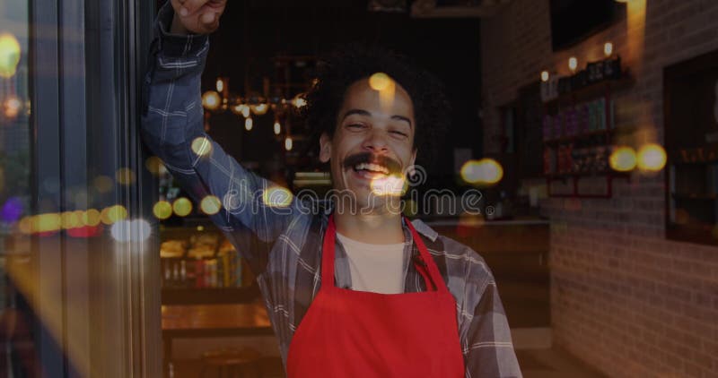 Image of spots of light over man working in cafe royalty free stock image