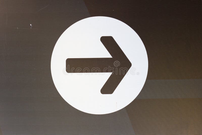 Image style is a White Arrow Down icon symbol inside a circle stock photo