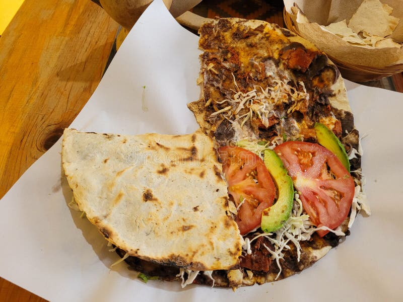 Image of a Typical Oaxacan Dish Called Tlayuda with Spicy Meat Stock