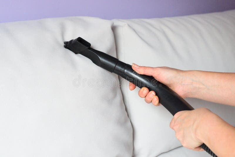 Vacuum cleaning the sofa stock photo. Image of hoover 133132326