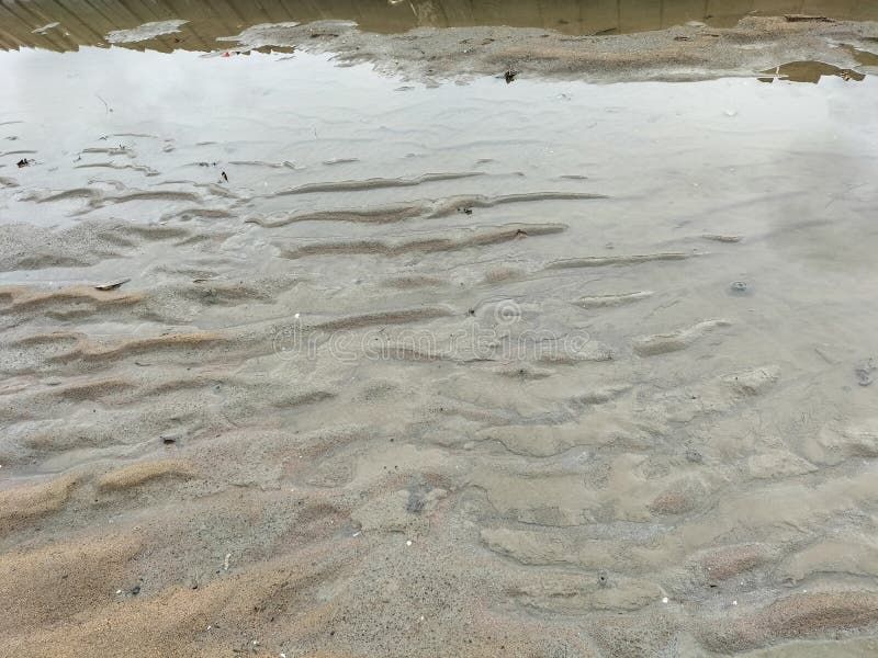 Image of wet sand at beach, suitable place for kids to play royalty free stock photography