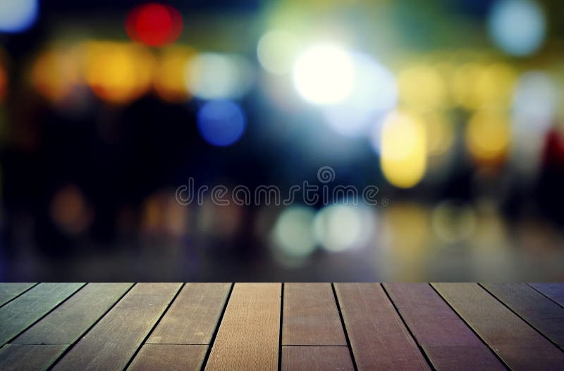 Image of Wooden Table in Front of Abstract Blurred Background Stock