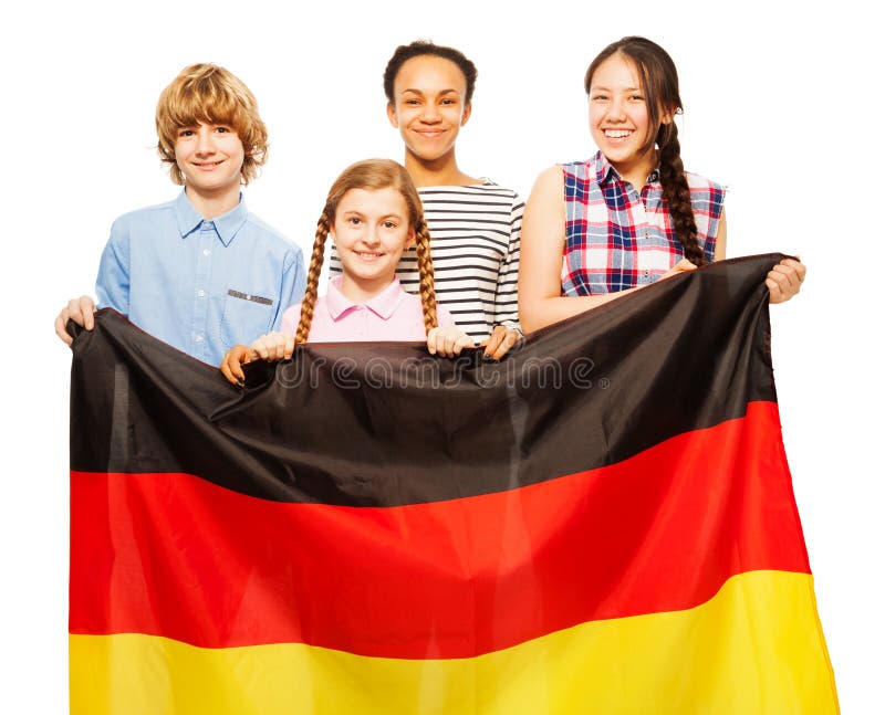 Imagem de quatro crianças adolescentes que guardam a bandeira alemão imagens de stock royalty free Imagem de quatro crianças adolescentes que guardam a bandeira alemão imagens de stock royalty free