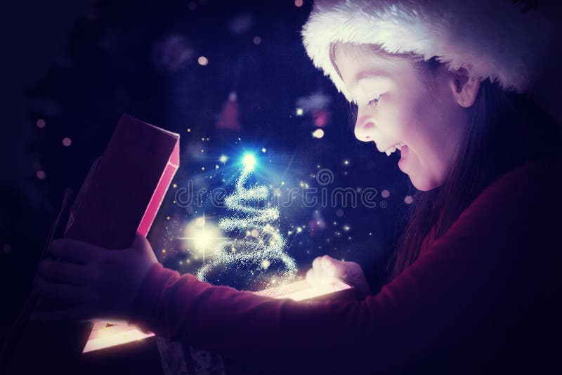 Little girl opening a magical christmas gift against christmas tree design. Little girl opening a magical christmas gift against christmas tree design