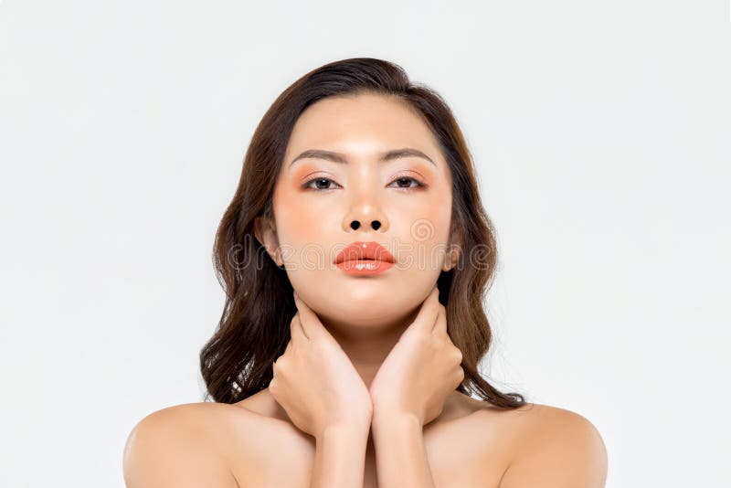 Beauty shot of glamorous Asian woman with makeup on her face isolated on white background. Beauty shot of glamorous Asian woman with makeup on her face isolated on white background