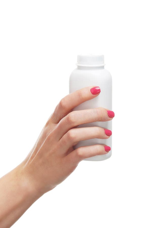 Imagen del primer de una mano femenina que sostiene una botella blanca imágenes de archivo libres de regalías Imagen del primer de una mano femenina que sostiene una botella blanca imágenes de archivo libres de regalías