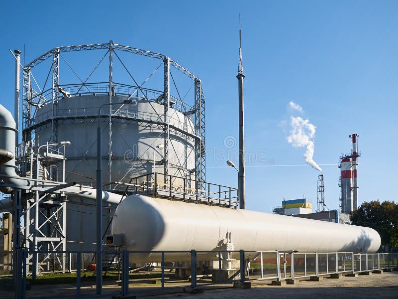 Huge horizontal liquid oxygen tank for the needs of medical institutions and hospitals and cylindrical oxygen gas-holder as example of chemical equipment example. Huge horizontal liquid oxygen tank for the needs of medical institutions and hospitals and cylindrical oxygen gas-holder as example of chemical equipment example