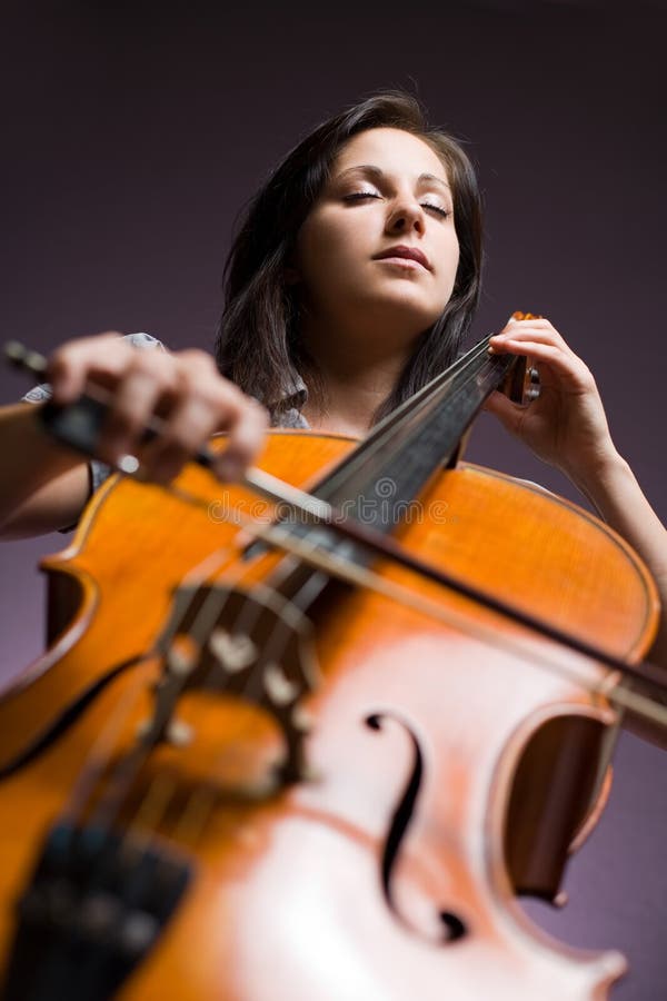 Intense Portrait Of Young Woman In Plaid Skirt. Stock Photo - Image of