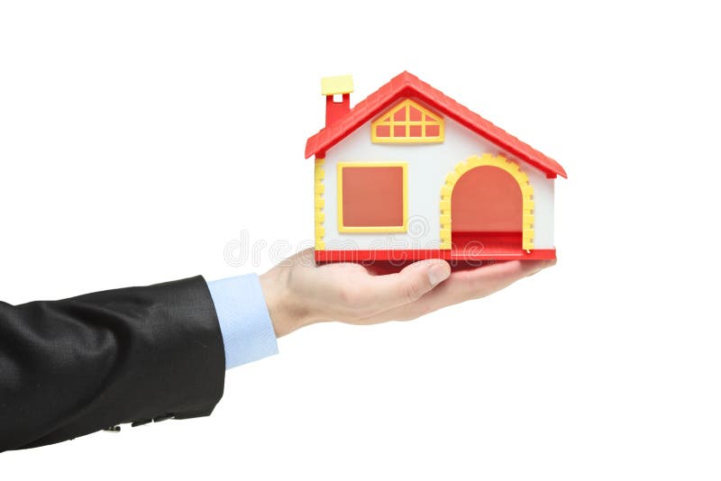 Immobilienmakler, der ein vorbildliches Haus in einer Hand anhält stockfotos Immobilienmakler, der ein vorbildliches Haus in einer Hand anhält stockfotos