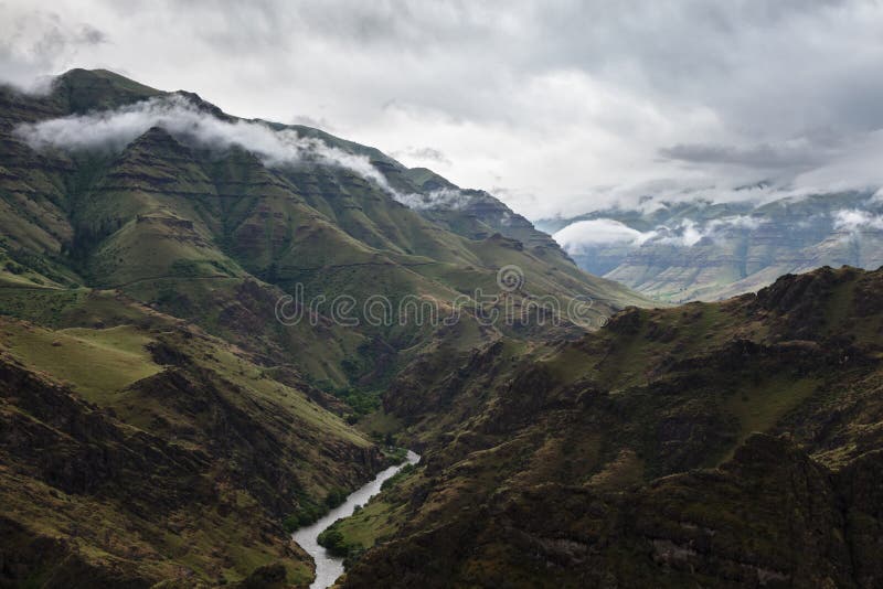 Imnaha River Runs through the Imnaha Canyon before a Storm stock photography Imnaha River Runs through the Imnaha Canyon before a Storm stock photography