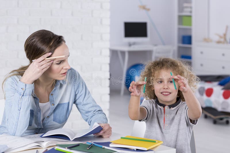 Five years student over her whole year homework. Homework overload for kids  concept Stock Photo - Alamy