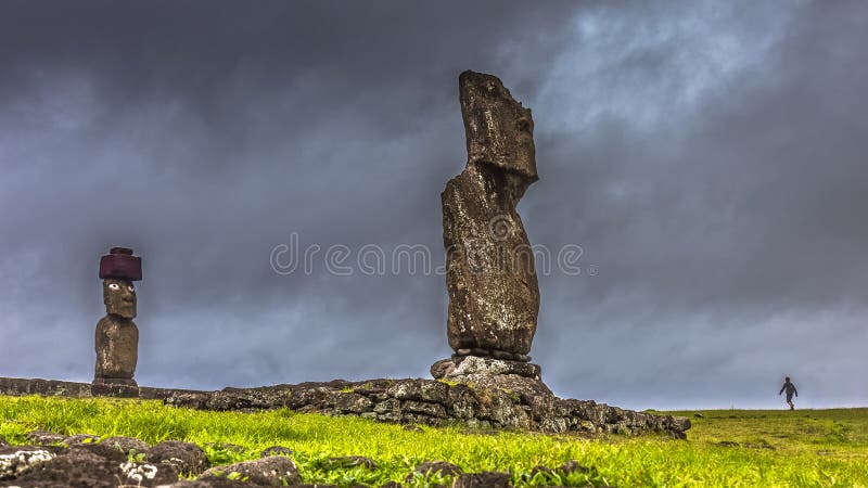 Impending Storm approaching Easter Island while a child is out playing royalty free stock photos Impending Storm approaching Easter Island while a child is out playing royalty free stock photos