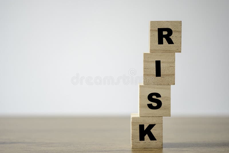 Stacking of wooden which print screen risk wording on the table with copy space. risk management concept. Stacking of wooden which print screen risk wording on the table with copy space. risk management concept.