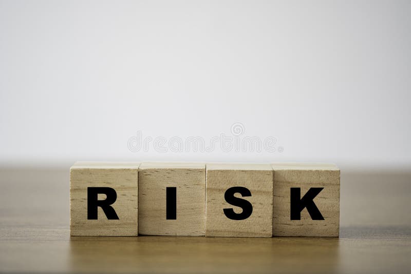 Stacking of wooden which print screen risk wording on the table with copy space. risk management concept. Stacking of wooden which print screen risk wording on the table with copy space. risk management concept.