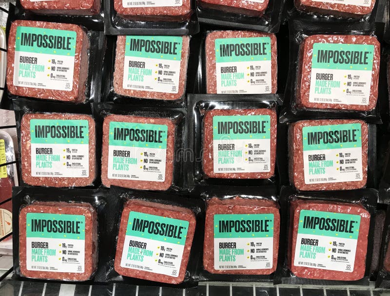 Impossible Foods brand plant-based Impossible Burgers available for vegan customers in the meat section of grocery store stock photography