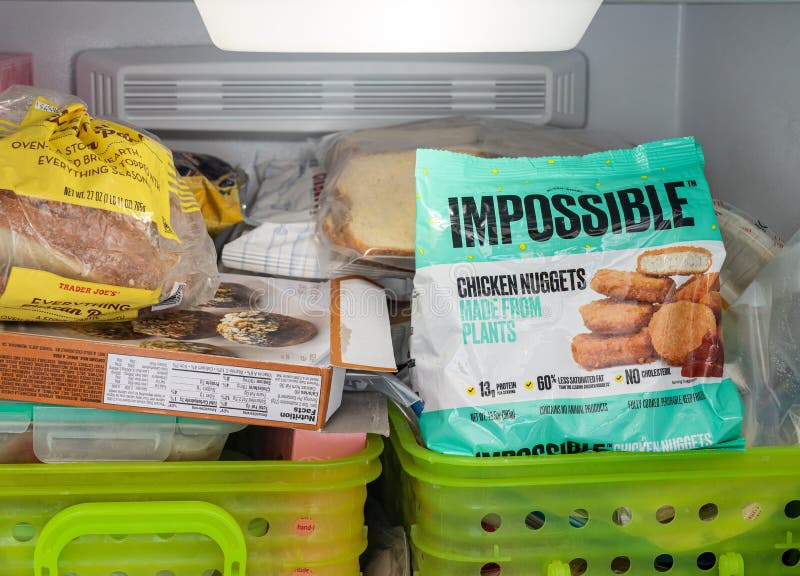 Impossible plant based chicken nuggets package in freezer royalty free stock images