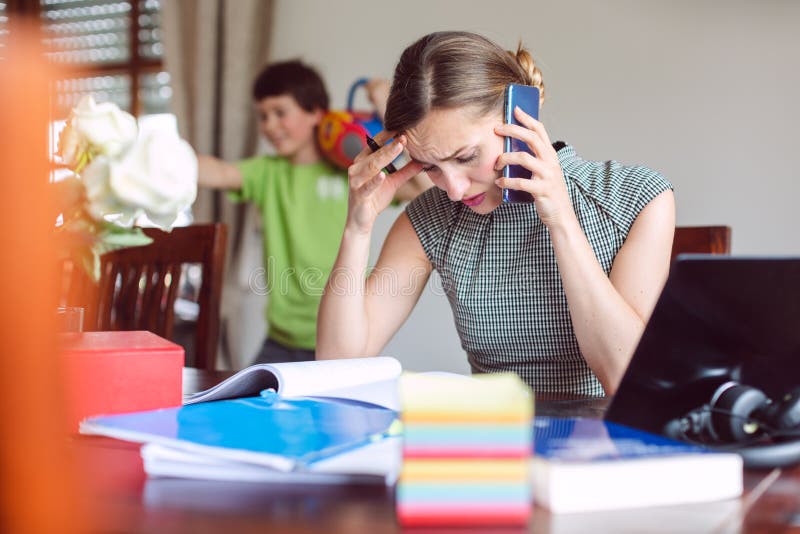 Stressed Businesswoman forced to work from home during lockdown cannot concentrate on work. Stressed Businesswoman forced to work from home during lockdown cannot concentrate on work