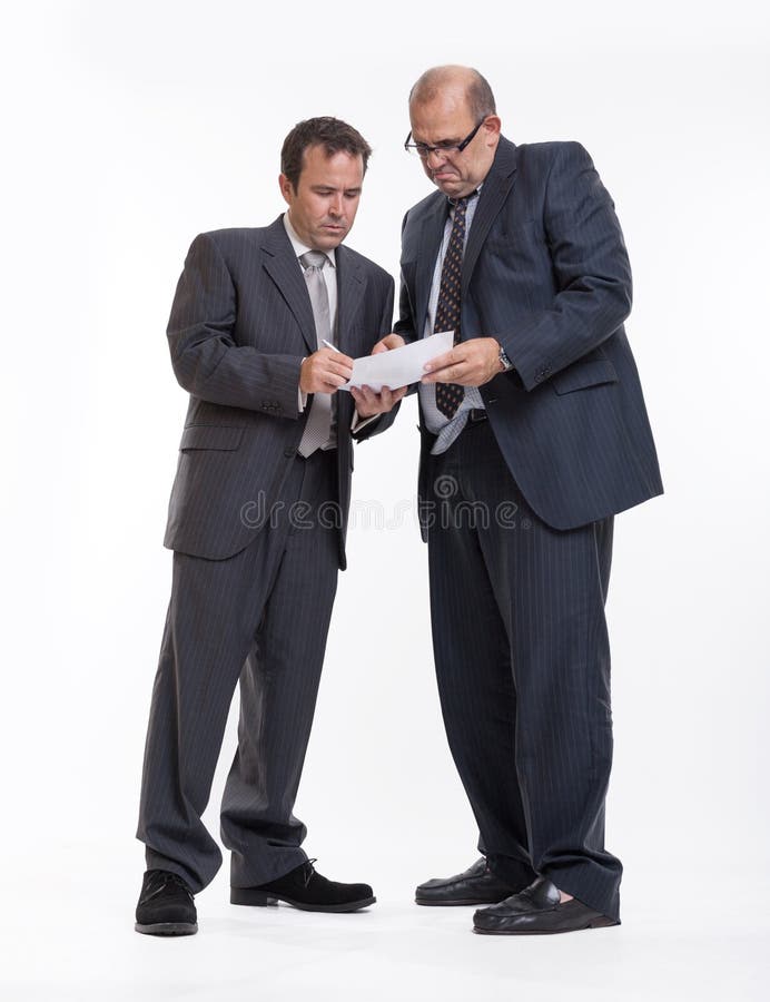 A men signing a document under pressure. A men signing a document under pressure