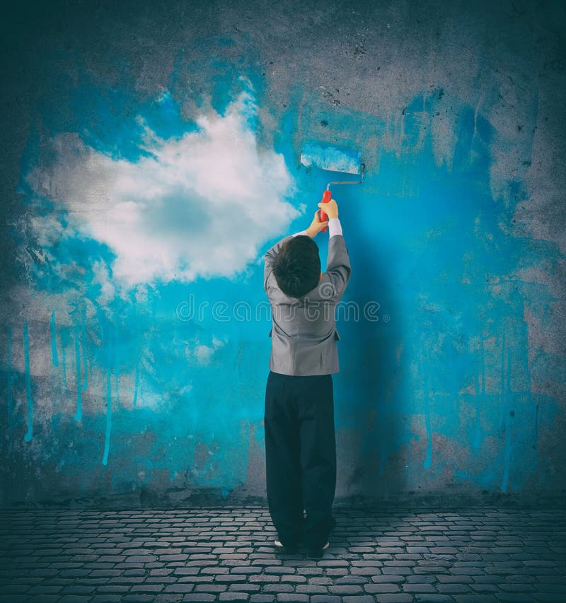 Improve your perspective. Child paints a sky on a gray wall royalty free stock photo Improve your perspective. Child paints a sky on a gray wall royalty free stock photo