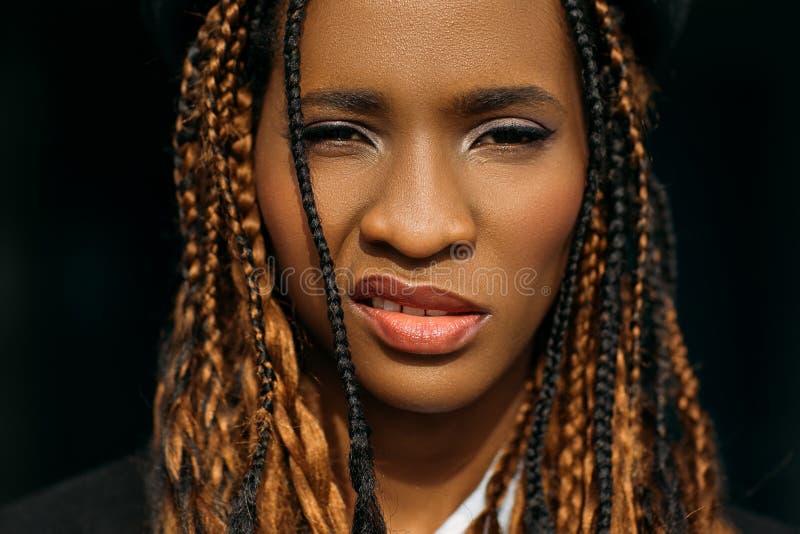 Young woman posing over yellow background. Emotional female