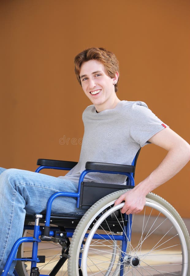 Portrait of a young man in a wheelchair. Portrait of a young man in a wheelchair