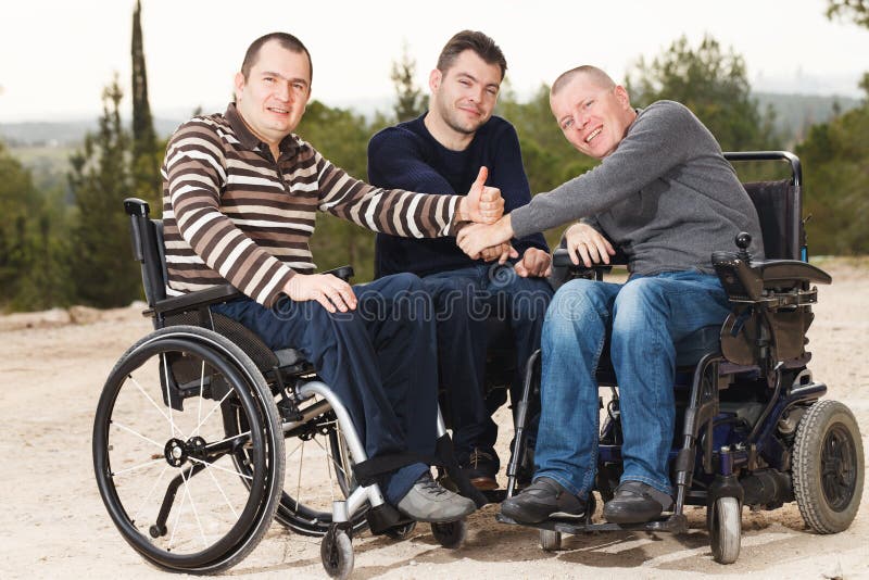 Disabled happy friends with thumbs up. Disabled happy friends with thumbs up.