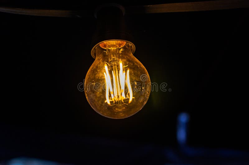 Incandescent Light Bulb Illuminates the Dark Stock Image Image of