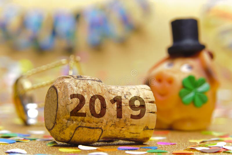 Cork stopper of champagne with new year`s date 2019 and lucky charm. Cork stopper of champagne with new year`s date 2019 and lucky charm