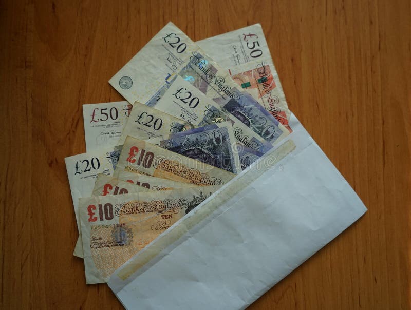 Envelope full of british pounds as a piece of certainty in the uncertain forthcoming Brexit. Envelope full of british pounds as a piece of certainty in the uncertain forthcoming Brexit.