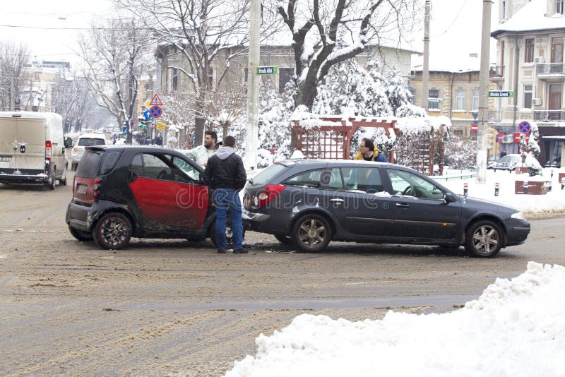 Car accident on a road covered with low amount of snow in Bucharest city. Car accident on a road covered with low amount of snow in Bucharest city