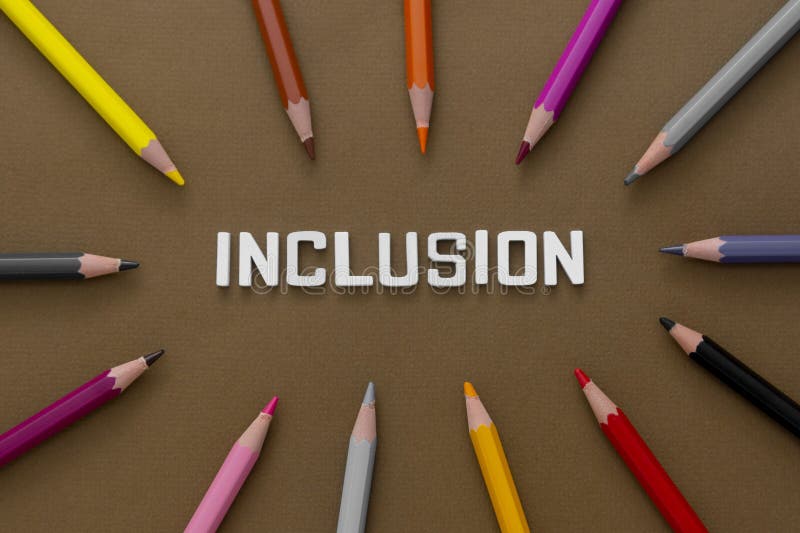 Inclusion word with colorful pencils over brown background. Equality, community integration concept. Top view