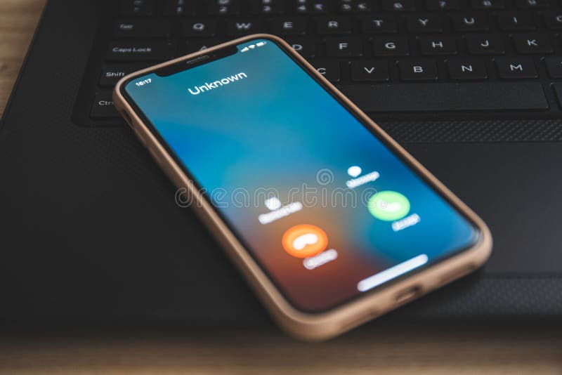 Incoming call from unknown number. Scam online on phone royalty free stock image