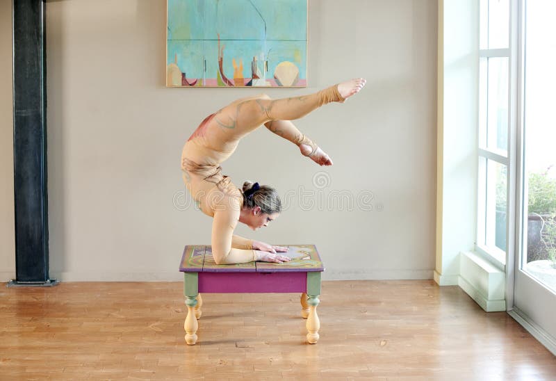 An artistic dancer balancing in a beautiful elbow stand. An artistic dancer balancing in a beautiful elbow stand.