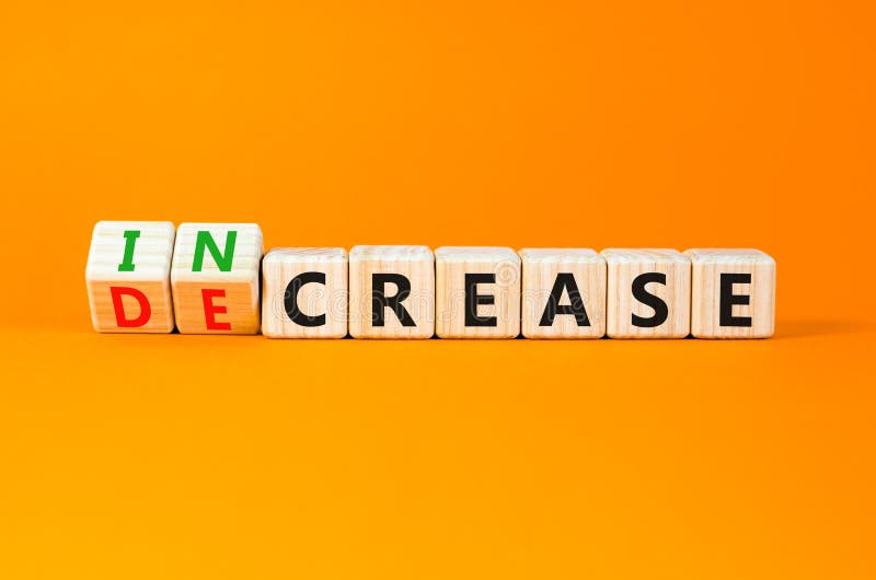 Increase or decrease symbol. Concept words Increase and Decrease on wooden cubes. Beautiful orange table orange background. Business increase or decrease concept. Copy space. Cost price decrease stock images, royalty-free photos and pictures