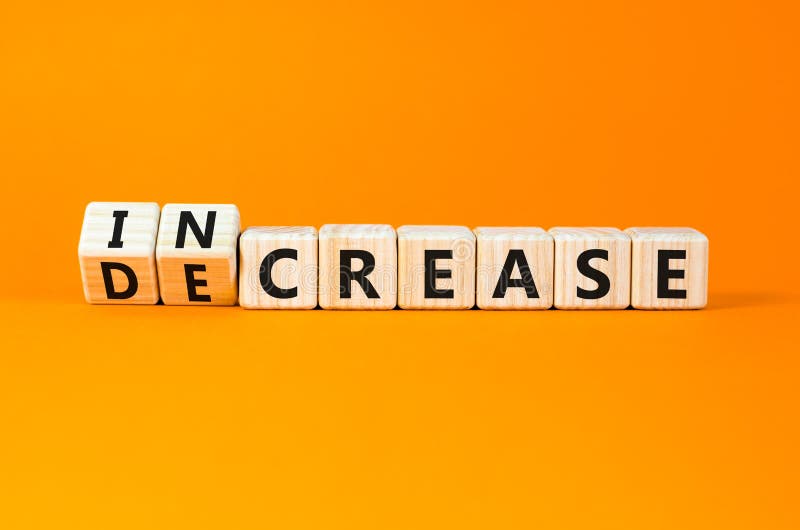 Increase or decrease symbol. Concept words Increase and Decrease on wooden cubes. Beautiful orange table orange background. Business increase or decrease concept. Copy space. Cost price decrease stock images, royalty-free photos and pictures