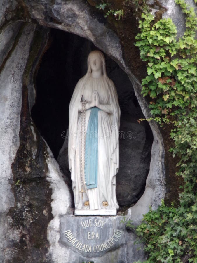 Virgin of Lourdes in cave stock photo. Image of serene - 79498602