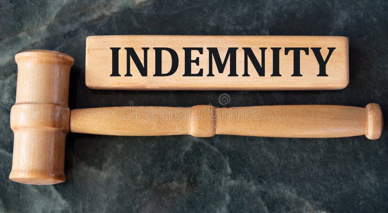 INDEMNITY Word on Wooden Blocks on a Green Background with a Judge S INDEMNITY Word on Wooden Blocks on a Green Background with a Judge S