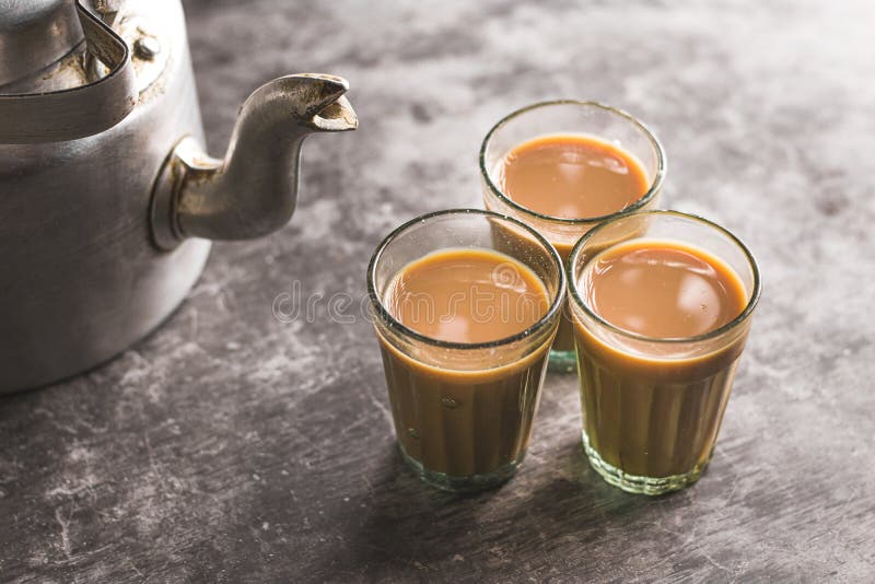 Indian chai in glass cups with masalas to make the tea. Stock