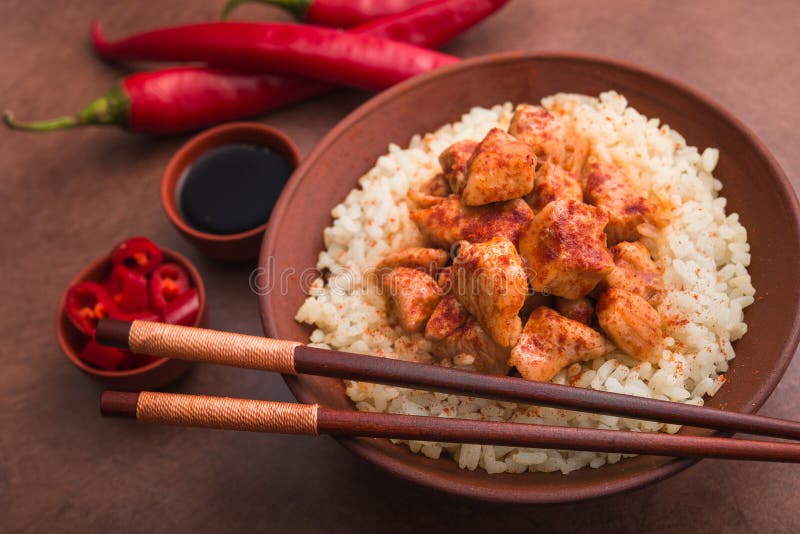 indian chicken curry with white rice and red chili pepper