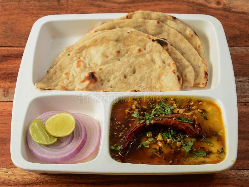 https://thumbs.dreamstime.com/b/indian-combo-meal-dal-tadka-naan-served-over-rustic-wooden-background-selective-focus-225929493.jpg