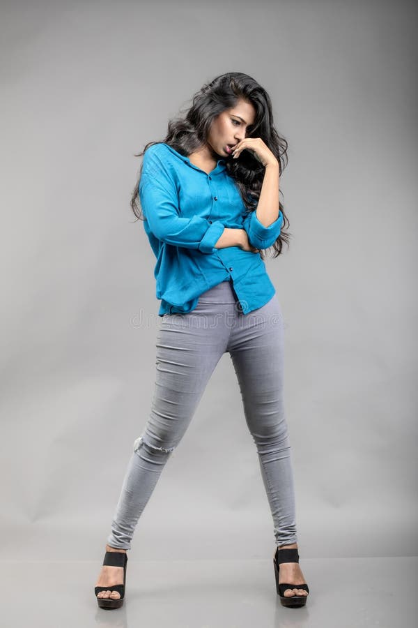 Indian Young Female Model in Casual Winterwear Against Grey