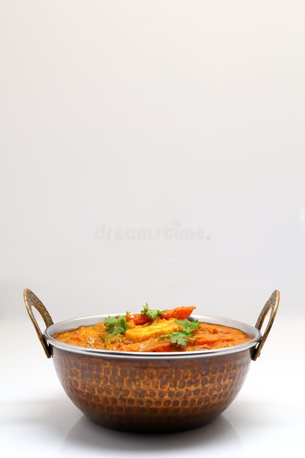 Indian Food or Indian Curry in a Copper Brass Serving Bowl Stock Image