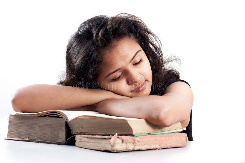 Indian Girl tired and sleeping with books