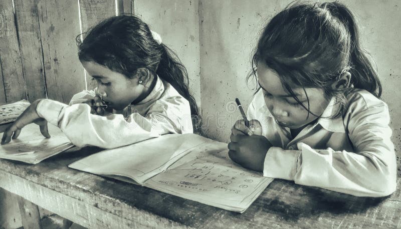 Indian Government School girls in the classroom writing some notes Assam government school girls royalty free stock image