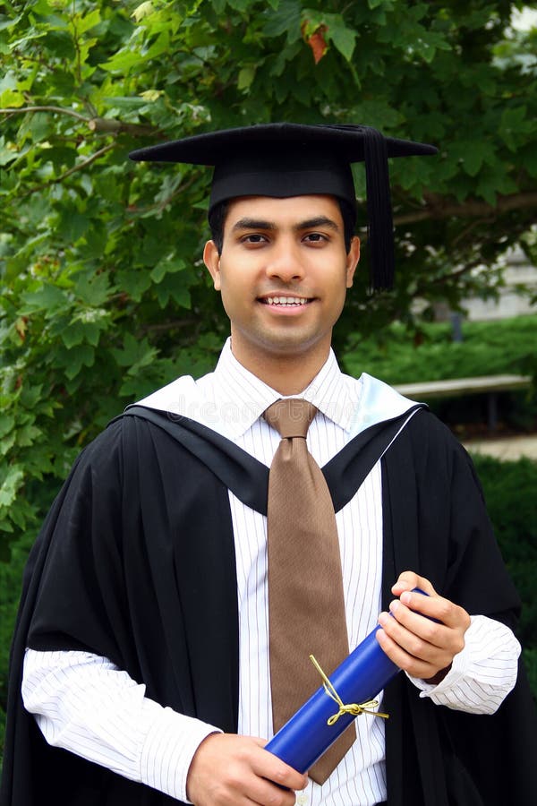 Indian guy in a graduation gown.