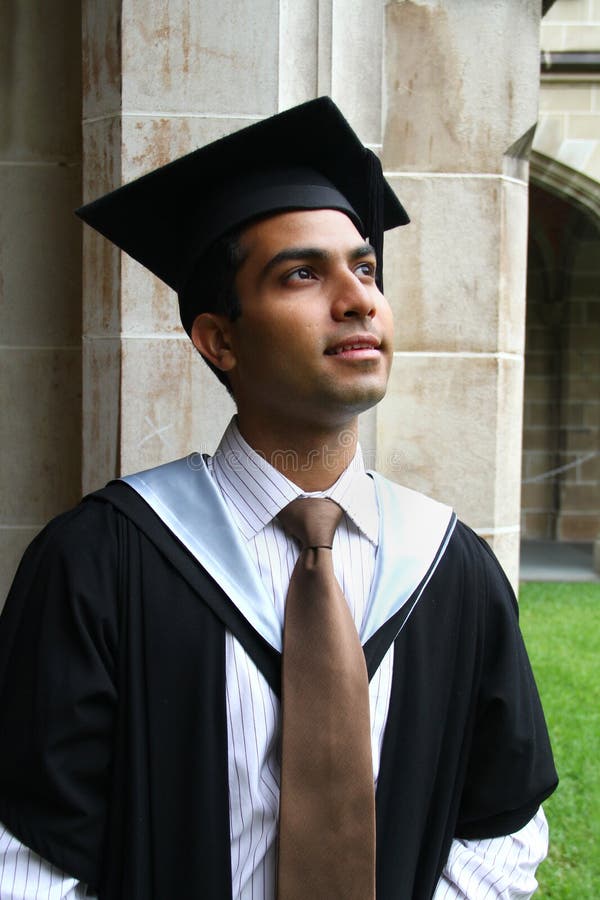 Indian guy in a graduation gown.